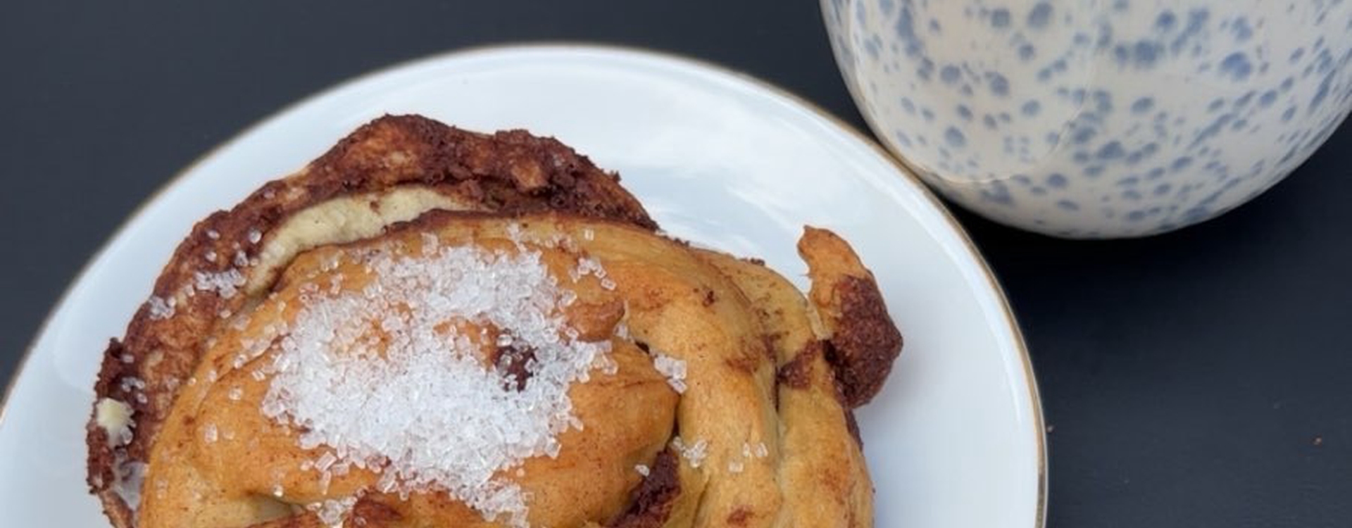 A cinnamon bun and a coffee.
