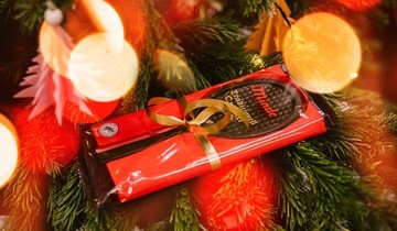 A traditional gift wraped chocolate tennis racket