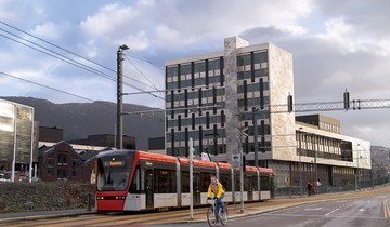 The campus of HVL in Bergen, with the light rail in the foreground. 