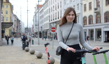 A girl with an electric scooter in Bergen.