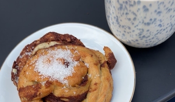 A cinnamon bun and a coffee.